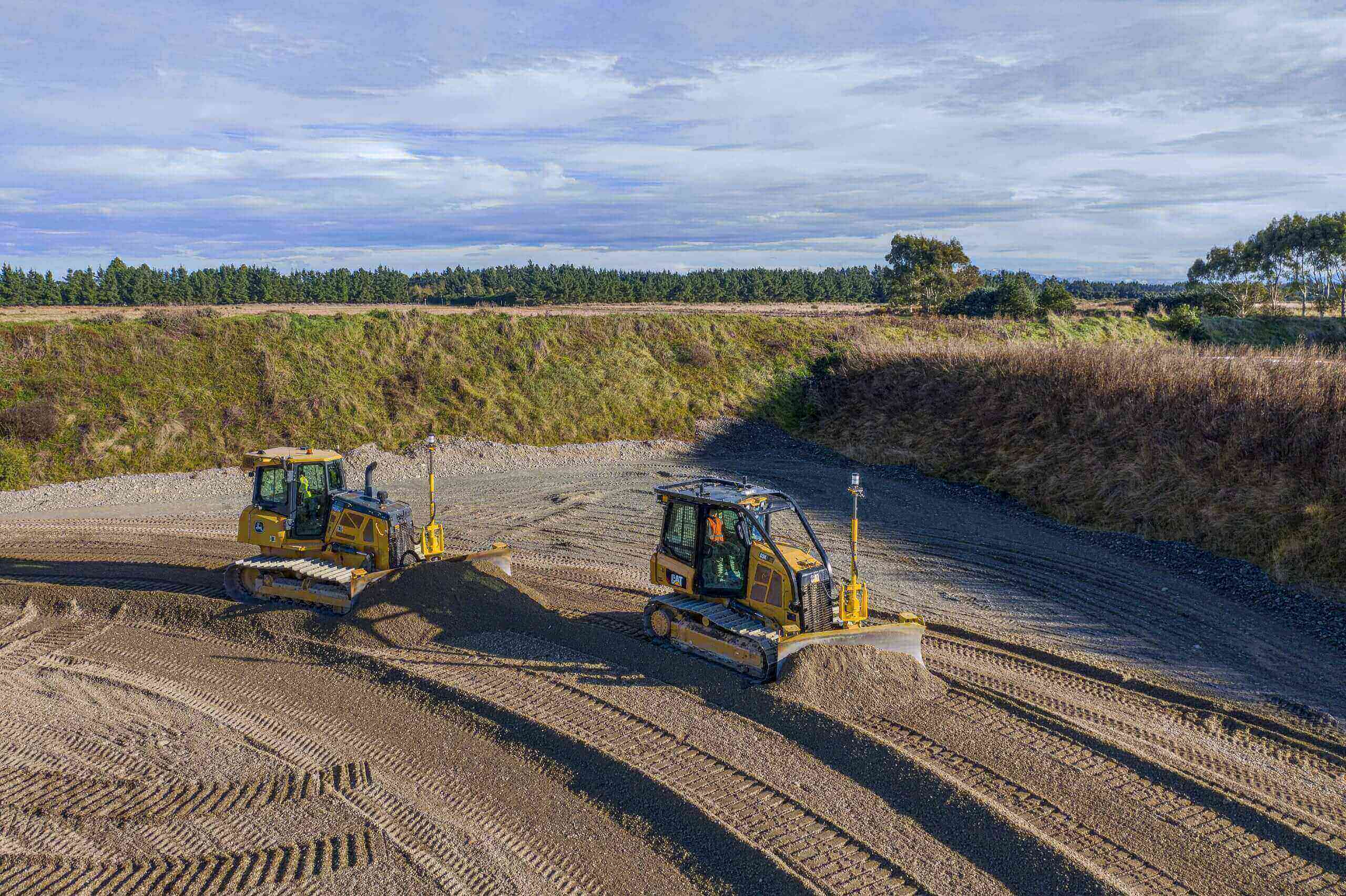 John Deere & CAT dozers using Earthworks technology